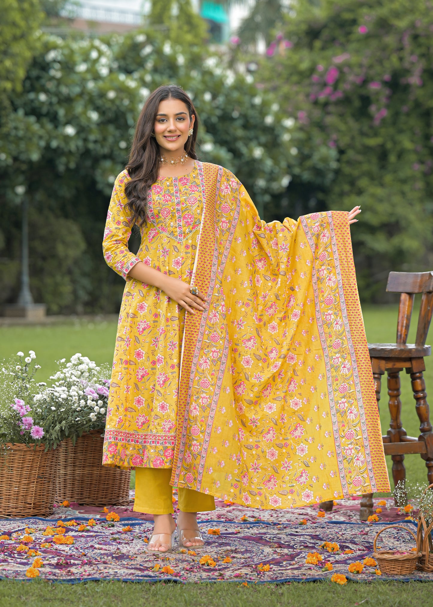 Elegant women's yellow Anarkali suit set with intricate embroidery and flared silhouette, perfect for festive and wedding wear