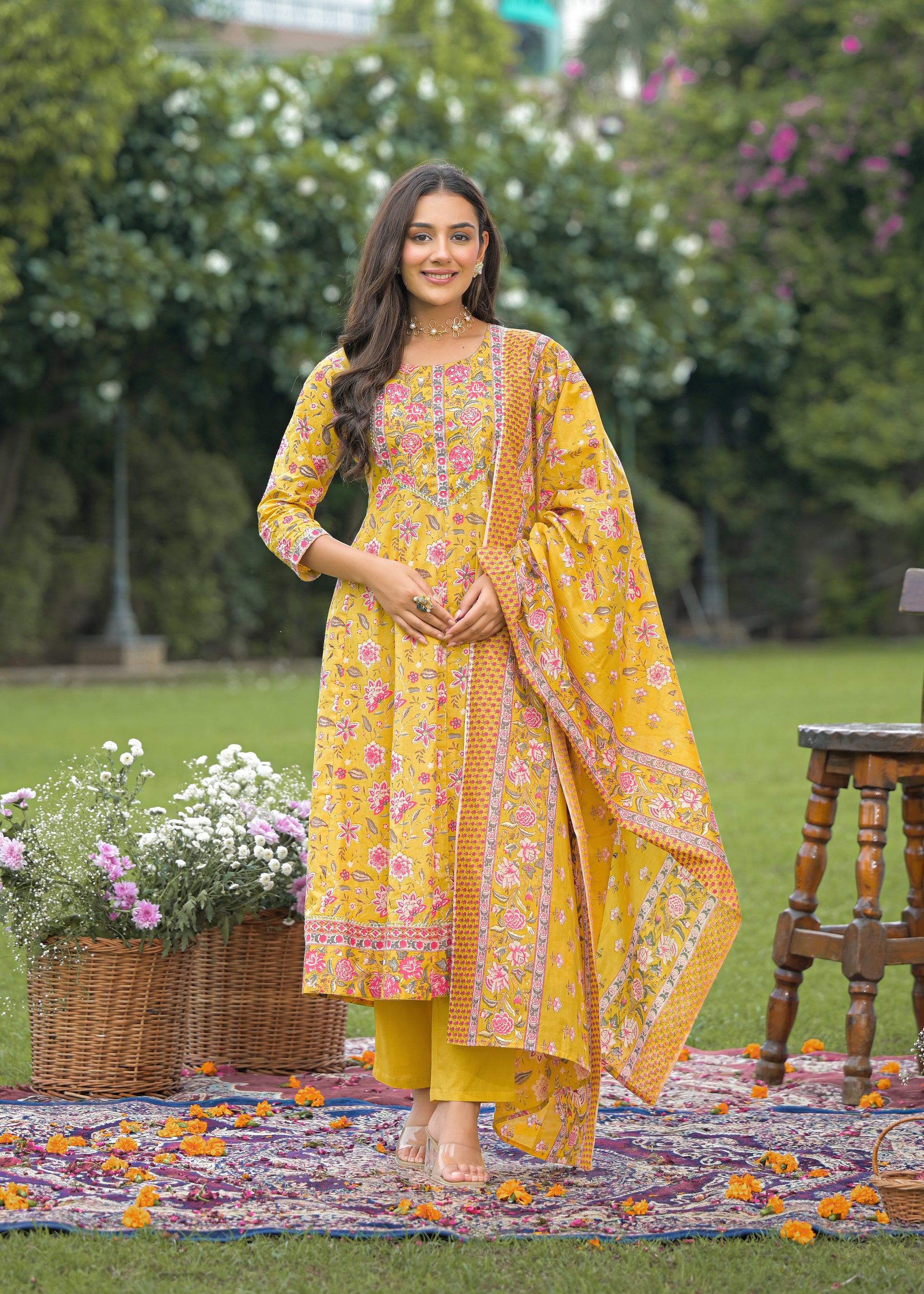 Elegant women's yellow Anarkali suit set with intricate embroidery and flared silhouette, perfect for festive and wedding wear