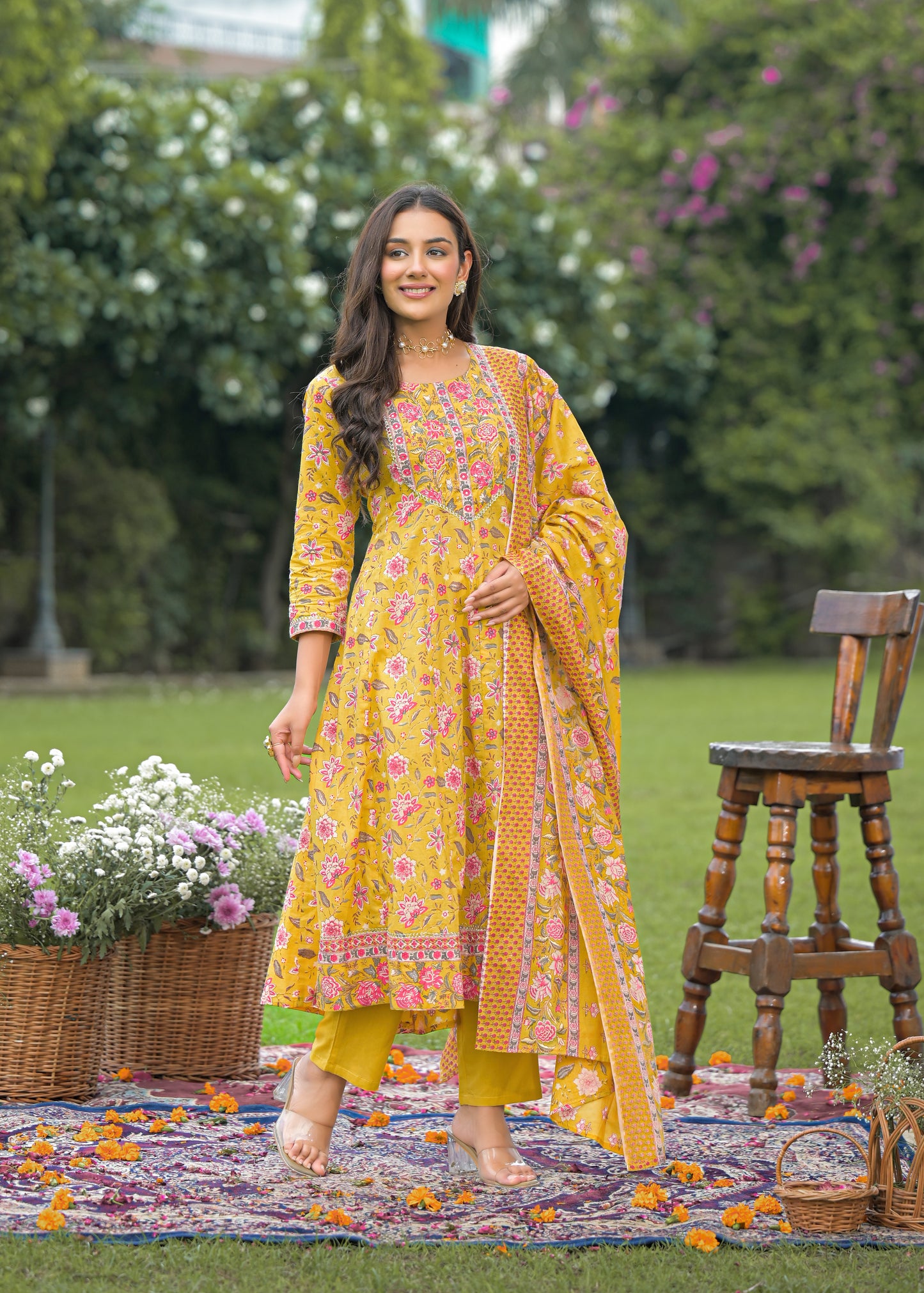 Elegant women's yellow Anarkali suit set with intricate embroidery and flared silhouette, perfect for festive and wedding wear