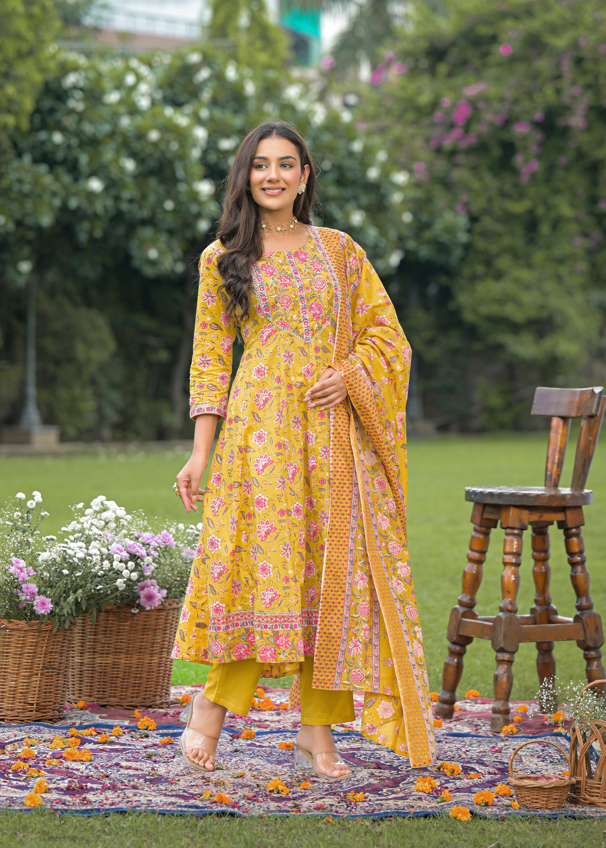Elegant women's yellow Anarkali suit set with intricate embroidery and flared silhouette, perfect for festive and wedding wear