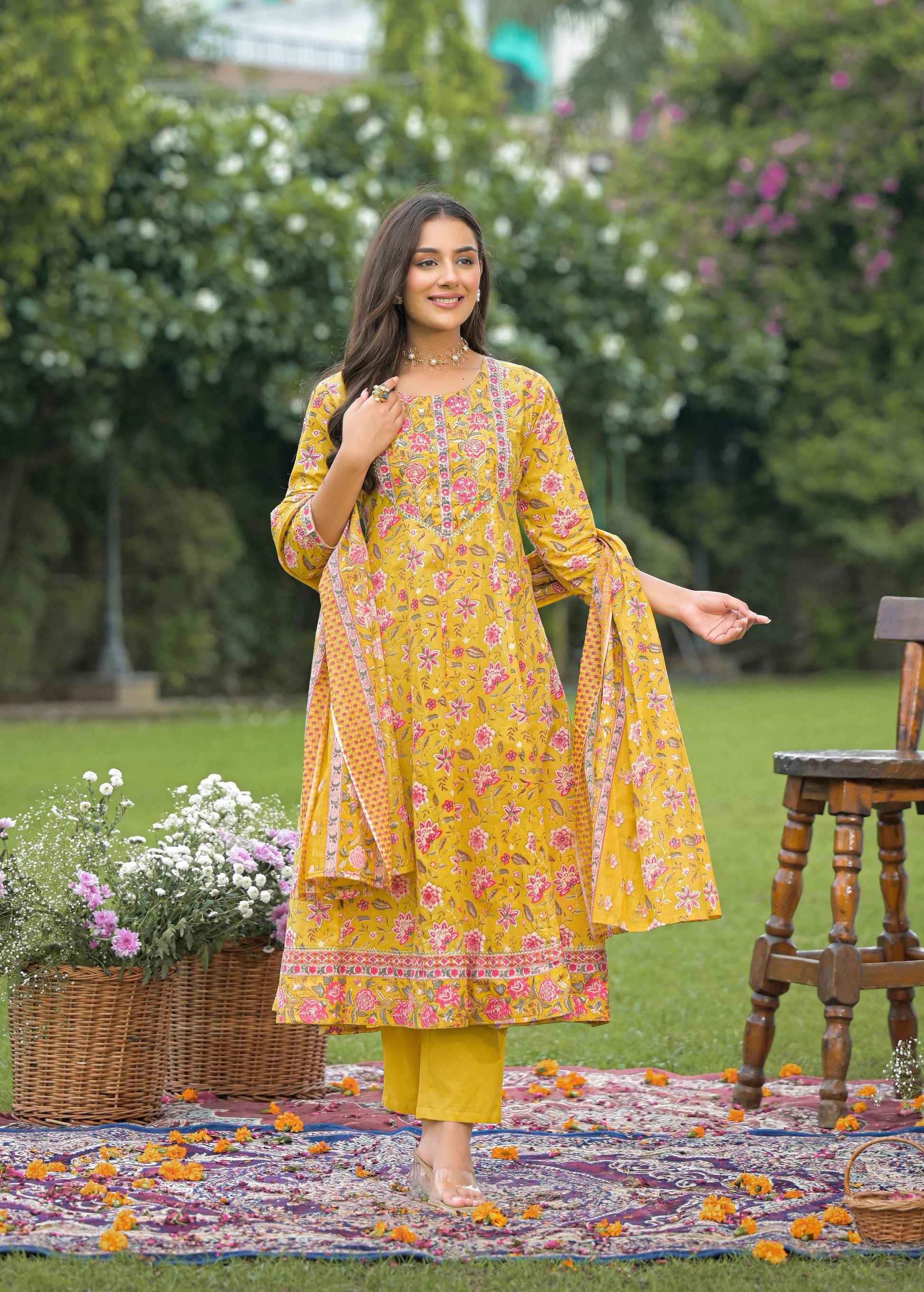 Elegant women's yellow Anarkali suit set with intricate embroidery and flared silhouette, perfect for festive and wedding wear