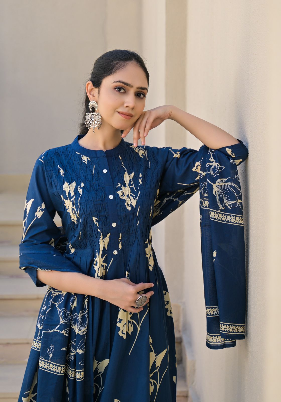 Women wearing cotton navy blue A-line kurta set with dupatta
