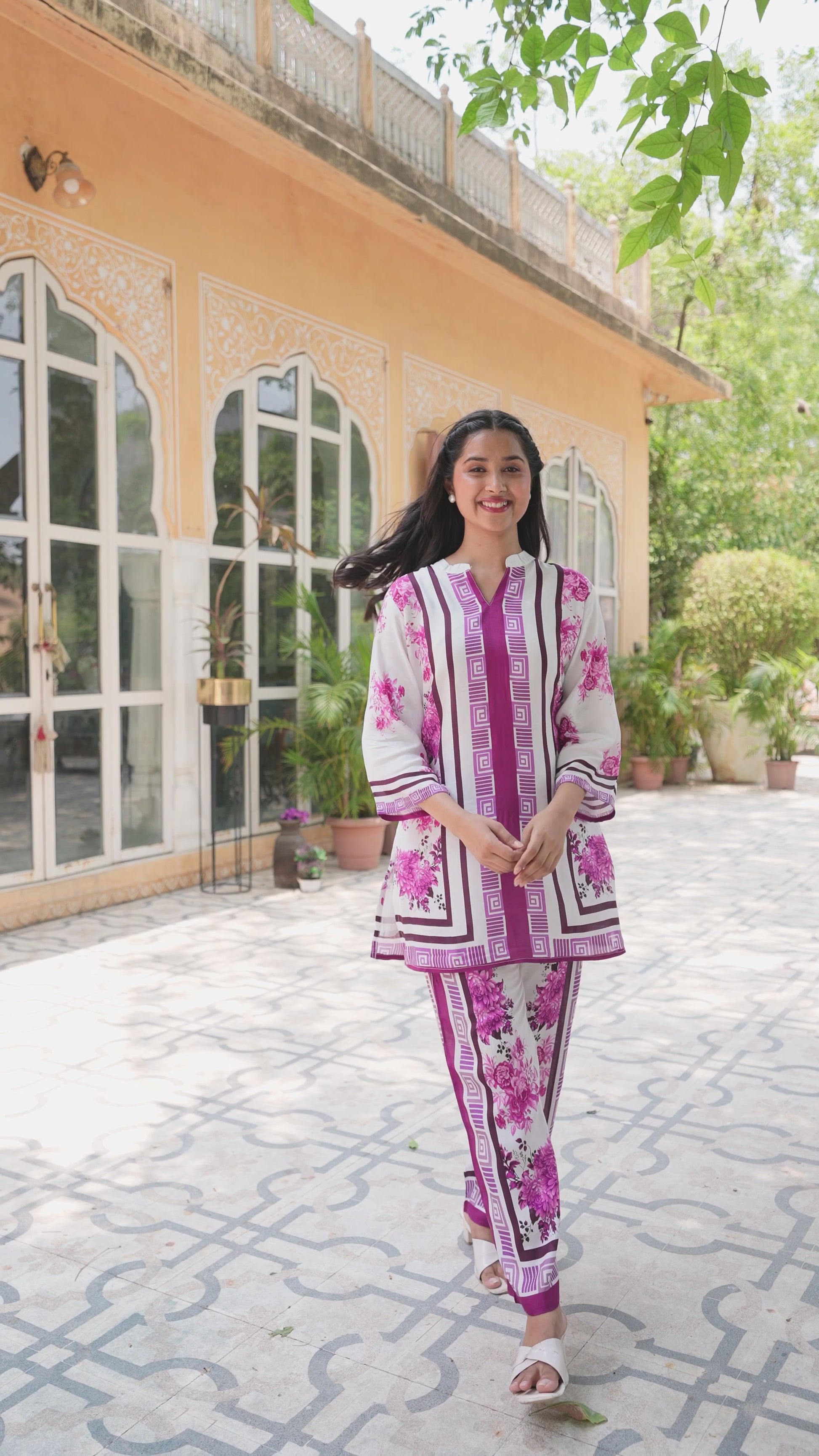 Women wearing pink muslin coord set.