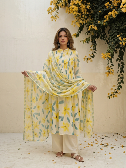 Floral cotton suit set featuring pintuck embroidered yoke and lightweight Kota Doriya dupatta