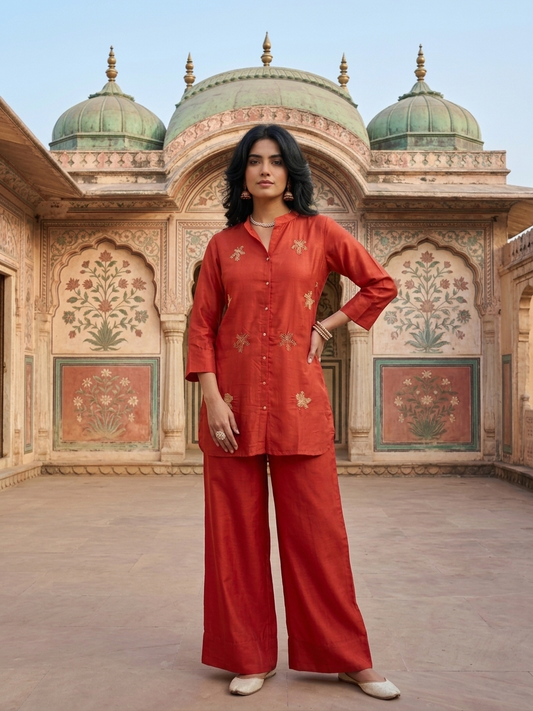 Women wearing Russian Silk Red co-ord set with golden leaf embroidery